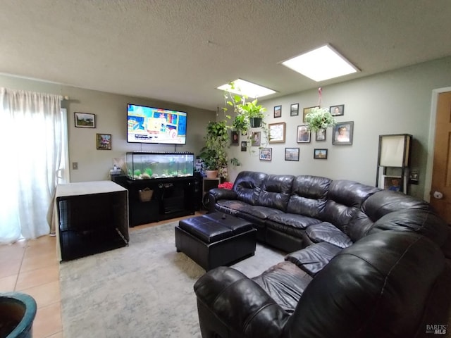 living room with light tile patterned flooring and a textured ceiling