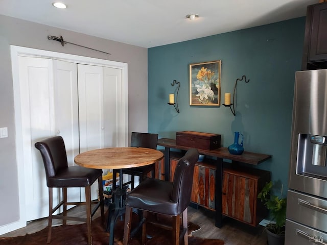 dining area featuring dark wood-type flooring