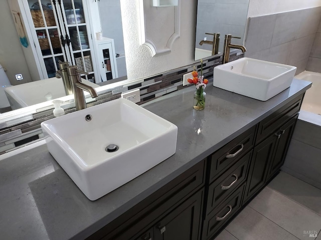 bathroom featuring backsplash and vanity