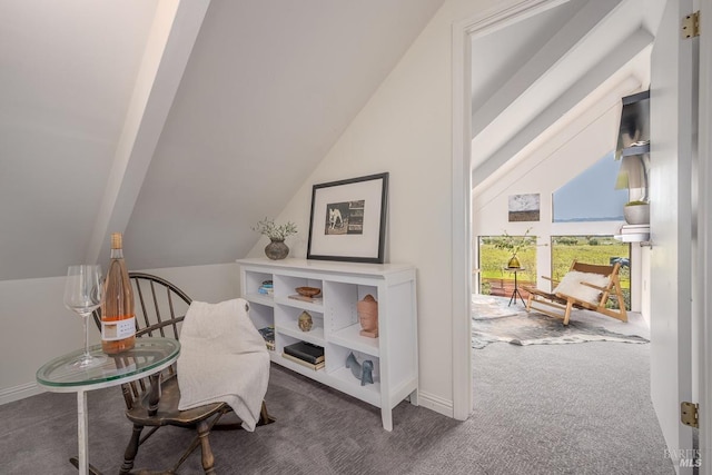 living area featuring dark carpet and lofted ceiling