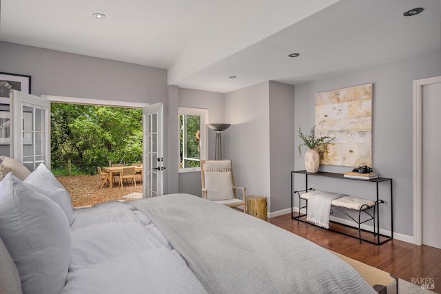 bedroom with dark hardwood / wood-style flooring
