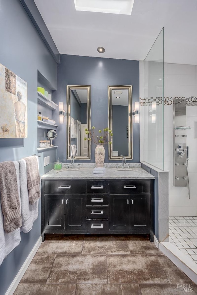 bathroom featuring a shower and vanity