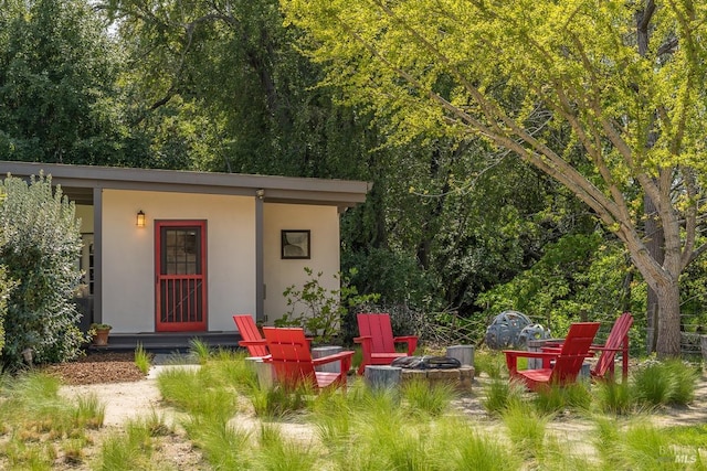 view of outdoor structure featuring a fire pit
