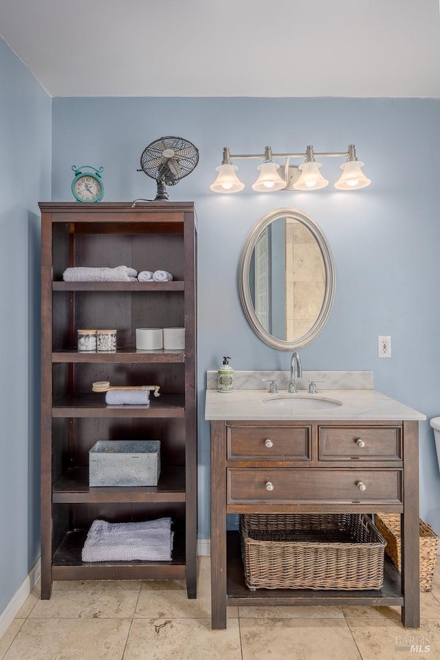 bathroom featuring tile patterned flooring and vanity