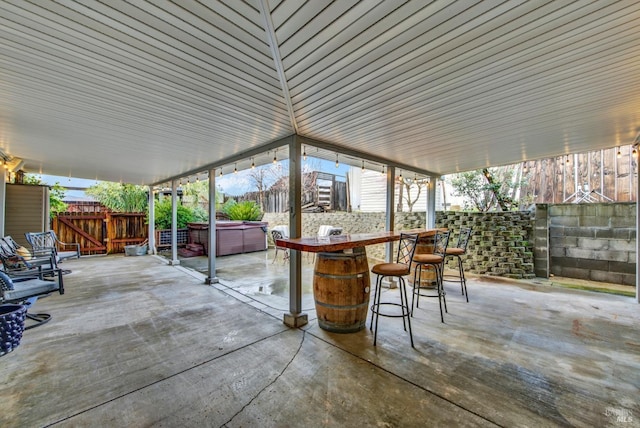 view of patio with a hot tub