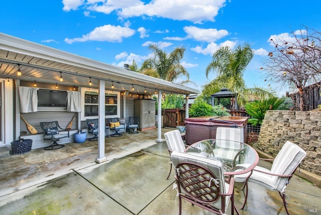 view of patio / terrace featuring a hot tub