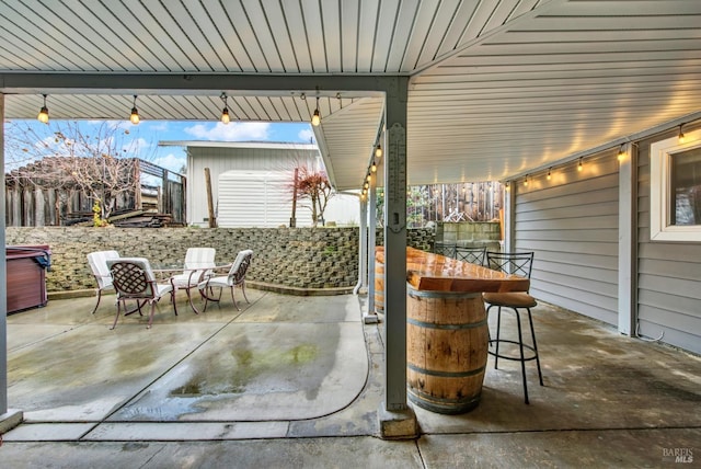 view of patio with a bar