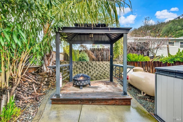 view of patio / terrace featuring a gazebo and a fire pit