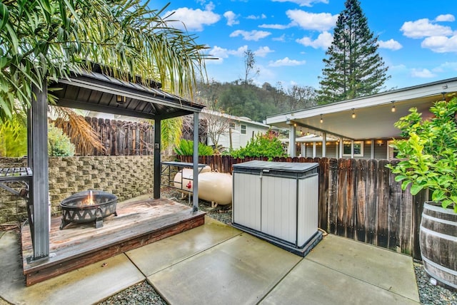 view of patio / terrace with a fire pit