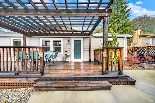 wooden deck featuring a pergola