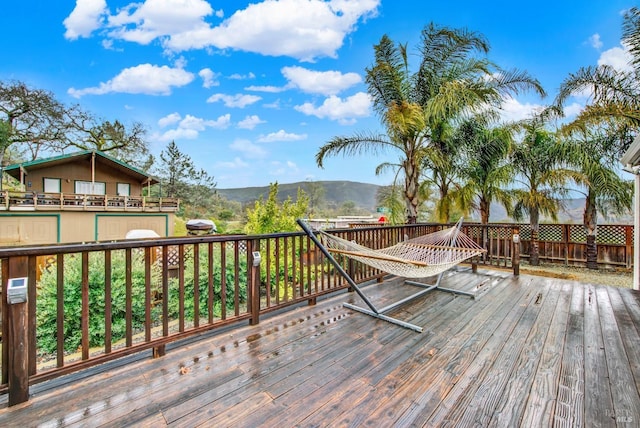 wooden terrace featuring a mountain view