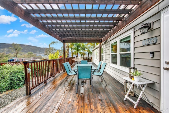 deck featuring a pergola and a mountain view