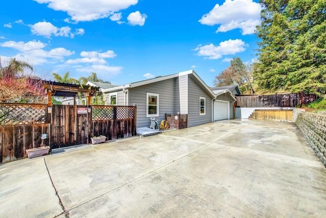 back of property featuring a garage