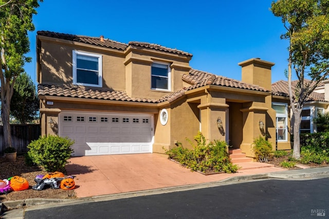 mediterranean / spanish house featuring a garage