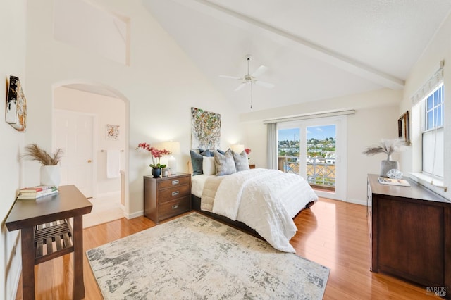 bedroom featuring access to outside, ceiling fan, beam ceiling, high vaulted ceiling, and light hardwood / wood-style floors