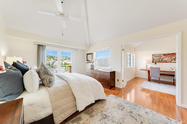 bedroom featuring vaulted ceiling with beams, ceiling fan, multiple windows, and light wood-type flooring