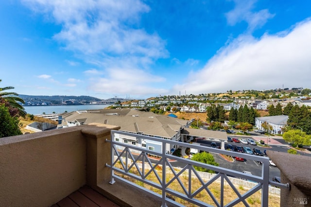 balcony featuring a water view