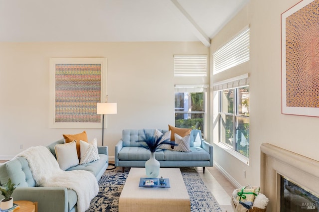 living room with lofted ceiling with beams