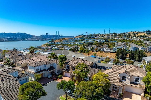 birds eye view of property featuring a water and mountain view