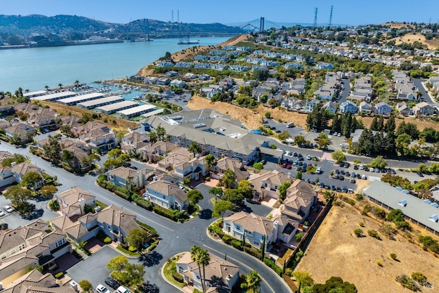 birds eye view of property with a water and mountain view