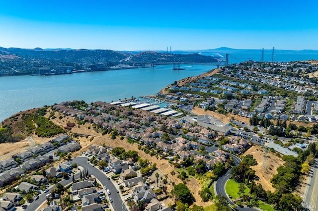 drone / aerial view with a water and mountain view