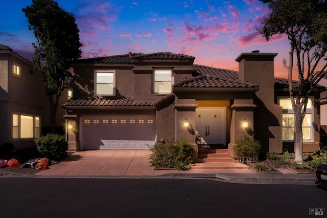 mediterranean / spanish-style house featuring a garage