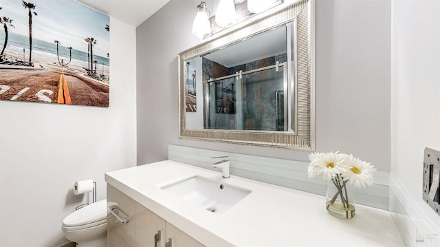 full bath with a stall shower, toilet, vanity, and a water view