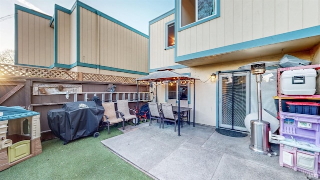 view of patio featuring a gazebo and a grill