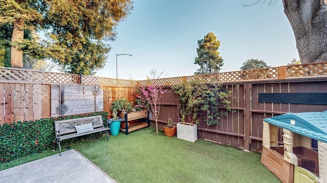 view of yard with a fenced backyard