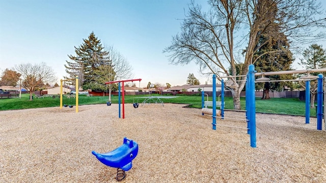 community jungle gym featuring a yard