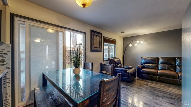 dining area featuring visible vents and wood finished floors