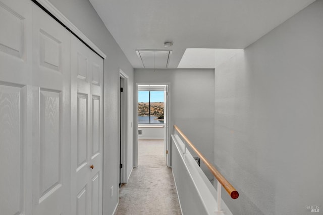 corridor with light colored carpet