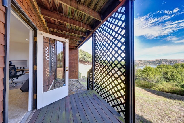 deck featuring a water view