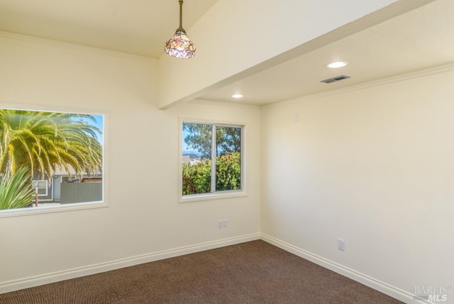 carpeted spare room featuring crown molding