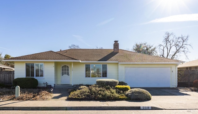 ranch-style house featuring a garage