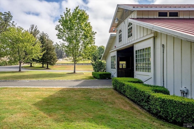 view of home's exterior with a lawn