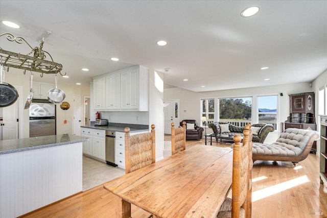 dining space with light hardwood / wood-style floors