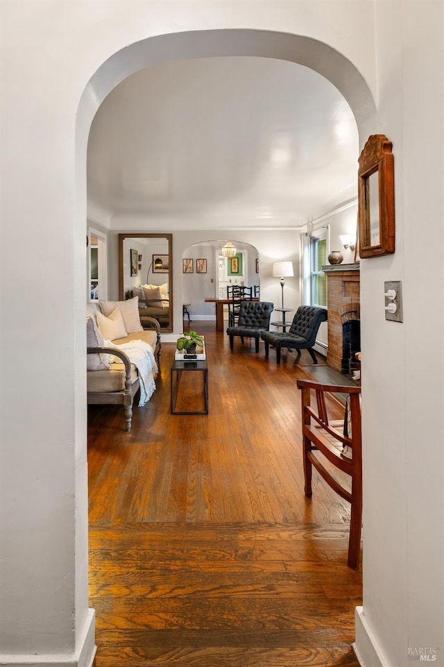 hall with hardwood / wood-style flooring