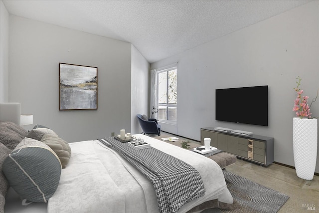 bedroom with a textured ceiling and carpet flooring