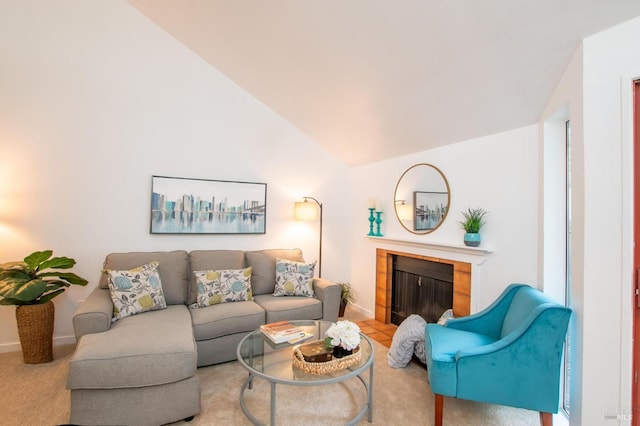 carpeted living room featuring lofted ceiling