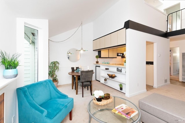 living room featuring light carpet and a high ceiling