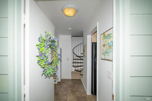 hall featuring tile patterned flooring