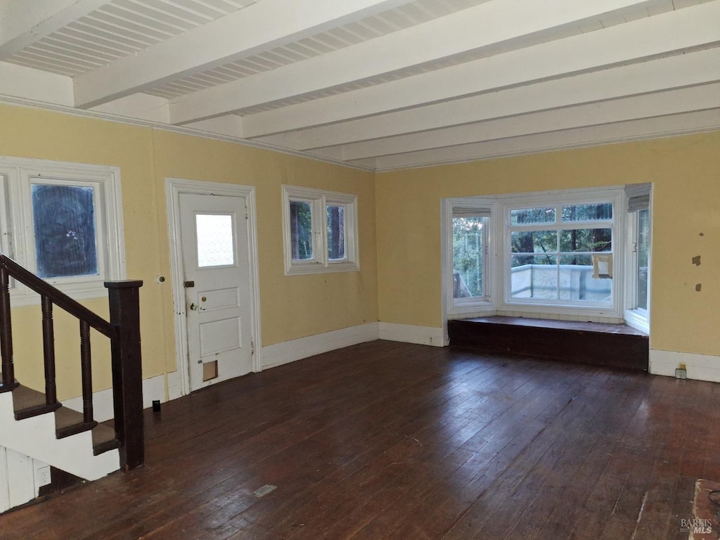 entrance foyer featuring dark hardwood / wood-style floors and beam ceiling