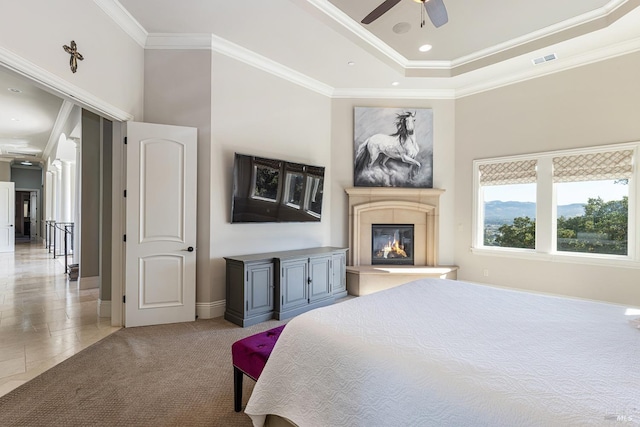 bedroom featuring ceiling fan, crown molding, and light tile patterned flooring