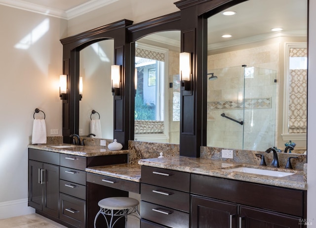 bathroom with vanity, walk in shower, and crown molding