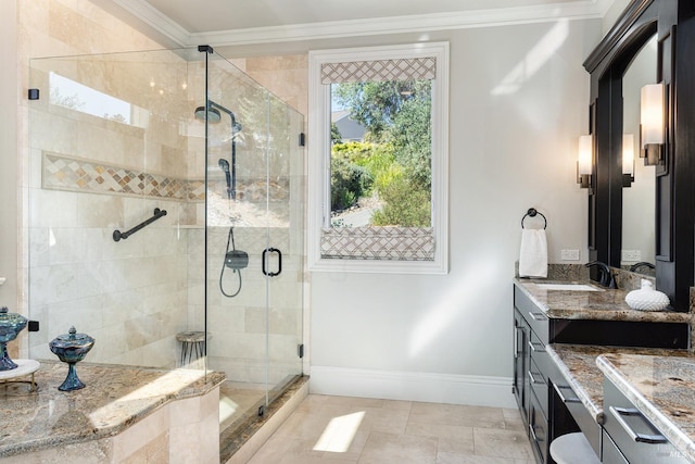 bathroom featuring vanity, a shower with shower door, and crown molding