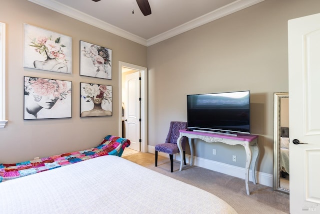 carpeted bedroom with ceiling fan and ornamental molding