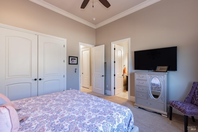 bedroom with ceiling fan, a closet, light colored carpet, and ornamental molding