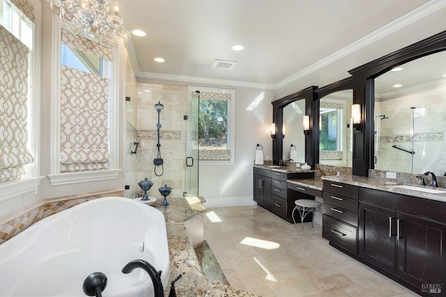 bathroom with independent shower and bath, ornamental molding, a wealth of natural light, and a chandelier