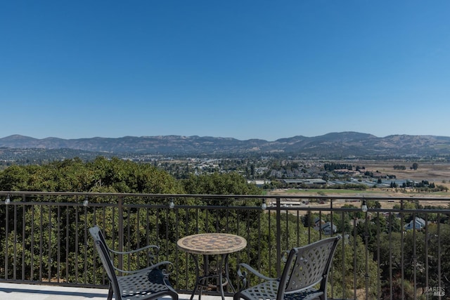 balcony featuring a mountain view